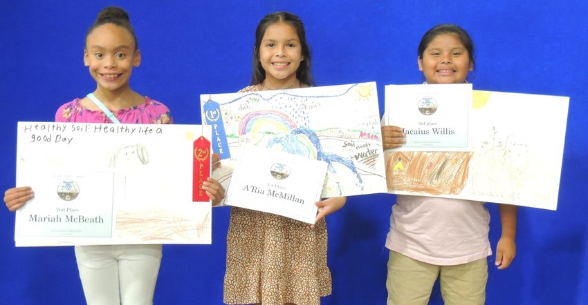 2022 Poster winners for grades 2-3 Mariah McBeath(2nd place), A’Ria McMillan(1st place) and Jacaius Willis(3rd place)
